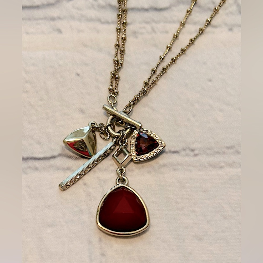 Pretty gold and maroon sparkly four charm necklace.
